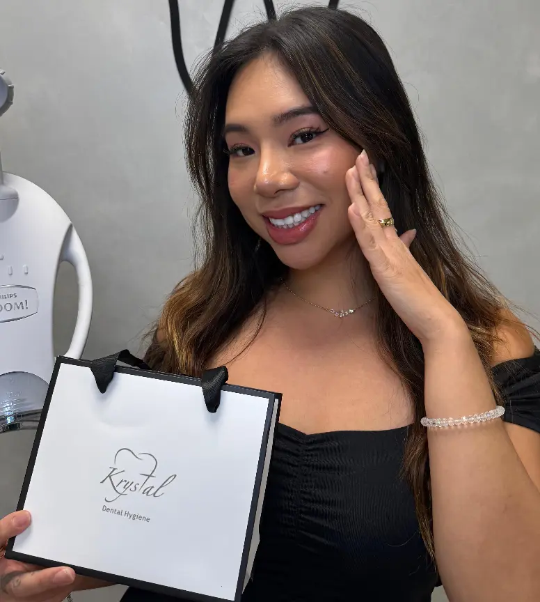 Smiling client after her whitening appointment